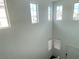 Foyer featuring tall windows and a white door at 5513 Silent Springs Dr, Las Vegas, NV 89122
