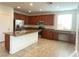 Spacious kitchen featuring stainless steel appliances and granite countertops at 5513 Silent Springs Dr, Las Vegas, NV 89122