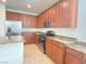 Modern kitchen with stainless steel appliances and granite countertops at 5513 Silent Springs Dr, Las Vegas, NV 89122