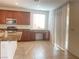 Spacious kitchen features granite countertops, stainless steel appliances, and sliding glass door at 5513 Silent Springs Dr, Las Vegas, NV 89122