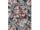 Neighborhood aerial view showcasing a home with a pool in a residential community at 5517 Bowerman Way, Las Vegas, NV 89130