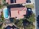 Aerial view of a property with a pool, trampoline, and outdoor seating area at 5517 Bowerman Way, Las Vegas, NV 89130