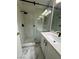 Contemporary bathroom features a glass enclosed shower with stone floor and updated vanity at 5517 Bowerman Way, Las Vegas, NV 89130