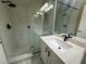 Contemporary bathroom features a glass enclosed shower with stone floor and updated vanity at 5517 Bowerman Way, Las Vegas, NV 89130