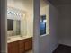 Bathroom with double sink vanity and modern lighting fixtures at 5536 Cleary Ct, Las Vegas, NV 89108