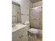 A clean and well-maintained bathroom featuring a vanity, toilet, and shower with gold trim at 5536 Cleary Ct, Las Vegas, NV 89108