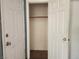 A small closet with an open doorway, wood hanging rack and visible flooring at 5536 Cleary Ct, Las Vegas, NV 89108