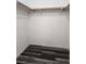A bright closet with wood-look flooring and a shelf and hanging rod ready for your personal touches at 5536 Cleary Ct, Las Vegas, NV 89108