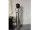 Garage view of water filtration system with a stainless steel filter at 5536 Cleary Ct, Las Vegas, NV 89108
