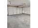 A spacious garage featuring a large door, providing secure parking and extra storage space at 5536 Cleary Ct, Las Vegas, NV 89108