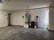 A spacious garage featuring a water heater and water filtration system at 5536 Cleary Ct, Las Vegas, NV 89108