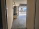 Garage view of water heater and view outside to front yard with curb appeal at 5536 Cleary Ct, Las Vegas, NV 89108