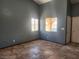 Bright living room with neutral walls, high ceilings, tiled floors, and large windows bringing in natural light at 5536 Cleary Ct, Las Vegas, NV 89108