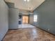 Open-concept living room with neutral walls and tile flooring, featuring natural light and high ceilings at 5536 Cleary Ct, Las Vegas, NV 89108