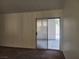 Spacious living room featuring a sliding glass door to the backyard patio at 5536 Cleary Ct, Las Vegas, NV 89108