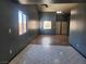 Spacious living room with neutral walls and tiled floors, offering ample natural light and access to other rooms at 5536 Cleary Ct, Las Vegas, NV 89108