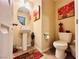Cozy half bathroom featuring a pedestal sink, decor, and tile flooring at 5634 Bishop Flowers St, Las Vegas, NV 89130