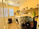 Bright laundry room features tile floors, washer, dryer, and decorative shelving at 5634 Bishop Flowers St, Las Vegas, NV 89130