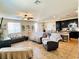 Open floor plan with tiled floors, ceiling fan and dark trim at 5634 Bishop Flowers St, Las Vegas, NV 89130