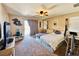 Bright main bedroom featuring a ceiling fan and sliding door to the balcony at 5634 Bishop Flowers St, Las Vegas, NV 89130
