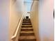 Carpeted staircase with white handrail leading to an upper level at 5634 Bishop Flowers St, Las Vegas, NV 89130