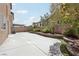 Backyard features hardscape, planter, artificial grass, and mature landscaping at 5655 Danforth Ave, Las Vegas, NV 89141
