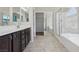 Bathroom boasts double sinks, lots of mirror, separate shower, soaking tub, and a walk-in closet at 5655 Danforth Ave, Las Vegas, NV 89141