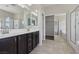 Bathroom boasts double sinks, lots of mirror, and separate shower and tub at 5655 Danforth Ave, Las Vegas, NV 89141