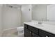 Powder room featuring vanity with dark cabinets and white countertop at 5655 Danforth Ave, Las Vegas, NV 89141
