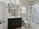 Well-lit bathroom with vanity, ample counter space, and glass-enclosed shower at 5655 Danforth Ave, Las Vegas, NV 89141