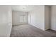 Spacious bedroom with neutral carpet, ample natural light, and closet space at 5655 Danforth Ave, Las Vegas, NV 89141