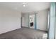 Spacious bedroom features plush carpeting and an ensuite bathroom with a double vanity at 5655 Danforth Ave, Las Vegas, NV 89141