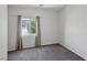 Cozy bedroom with plush carpet, window with views, and neutral wall color at 5655 Danforth Ave, Las Vegas, NV 89141
