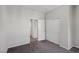 Bedroom with neutral carpet, closet space, and doorway to adjacent rooms at 5655 Danforth Ave, Las Vegas, NV 89141
