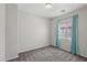 Bright bedroom with plush carpet, large window with curtains, and neutral paint at 5655 Danforth Ave, Las Vegas, NV 89141