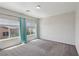 Bright bedroom with plush carpet, large windows with coverings, and neutral paint at 5655 Danforth Ave, Las Vegas, NV 89141