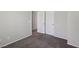 Comfortable bedroom with neutral carpet, closet, and doorway to adjacent rooms at 5655 Danforth Ave, Las Vegas, NV 89141