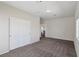 Large bedroom featuring neutral carpet, closet space, and a light, airy feel at 5655 Danforth Ave, Las Vegas, NV 89141