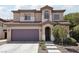 Charming two-story home with a well-manicured lawn, desert landscaping, and attached two car garage at 5655 Danforth Ave, Las Vegas, NV 89141