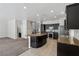 Spacious kitchen with stainless steel appliances, dark wood cabinets, and island at 5655 Danforth Ave, Las Vegas, NV 89141