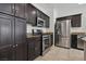 Well-equipped kitchen featuring stainless steel appliances and dark cabinetry at 5655 Danforth Ave, Las Vegas, NV 89141