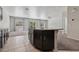 Eat-in kitchen featuring dark cabinetry, granite countertops, and a center island at 5655 Danforth Ave, Las Vegas, NV 89141