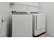 Efficient laundry room featuring modern washer and dryer units with storage at 5655 Danforth Ave, Las Vegas, NV 89141