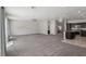 Spacious open-concept living area showcases neutral carpet and views of the backyard at 5655 Danforth Ave, Las Vegas, NV 89141