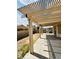 Covered patio area with a grill and backyard at 5711 Roundrock Dr, Las Vegas, NV 89142