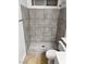 Walk-in shower with tiled walls and floor, as well as a toilet at 5711 Roundrock Dr, Las Vegas, NV 89142