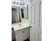 Bathroom featuring a single sink vanity with a large mirror at 5711 Roundrock Dr, Las Vegas, NV 89142