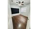 Cozy bedroom with laminate flooring, ceiling fan, and a window for natural light at 5711 Roundrock Dr, Las Vegas, NV 89142