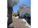 Two-story home showcasing the front exterior with an attached garage and desert landscaping at 5711 Roundrock Dr, Las Vegas, NV 89142