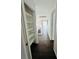 Bright upstairs hallway featuring wood floors, white trim and ample closet space at 5711 Roundrock Dr, Las Vegas, NV 89142